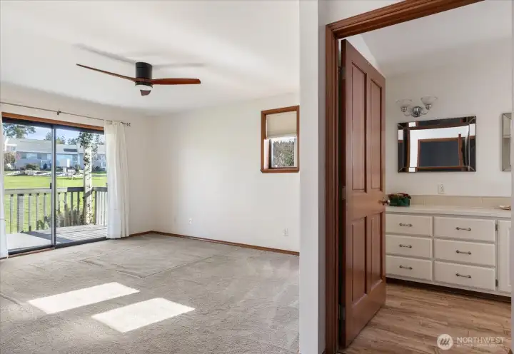 Primary bedroom, showing door to bathroom