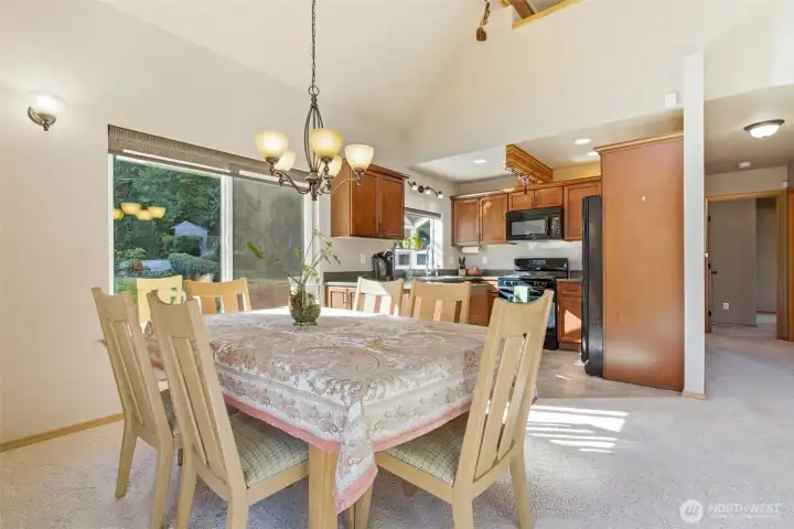Dining space positioned beneath dramatic rooflines, offering a unique and intimate setting.