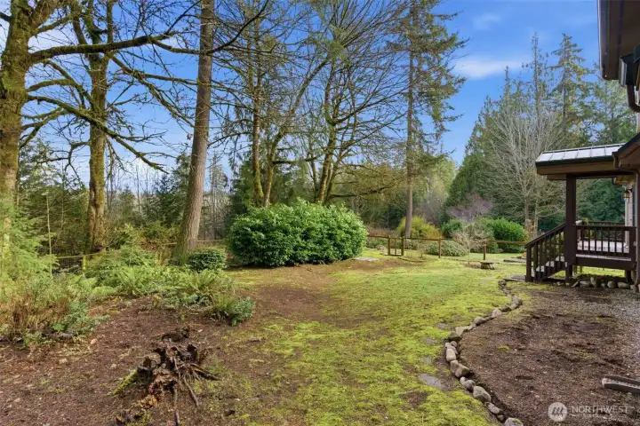 Mature trees and lush foliage surround this once in a life time residence.