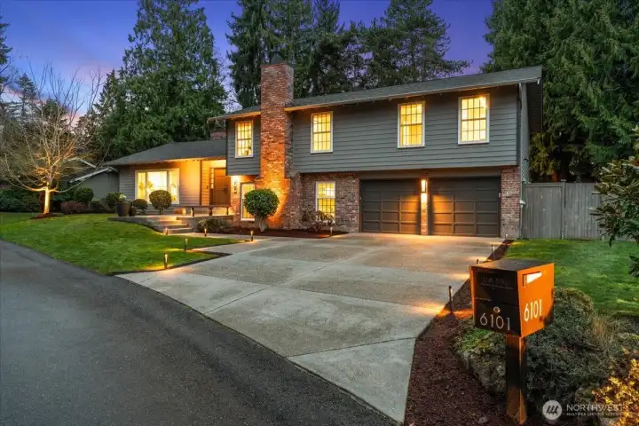 Tasteful landscape lighting and convenient drip irrigation for low maintenance