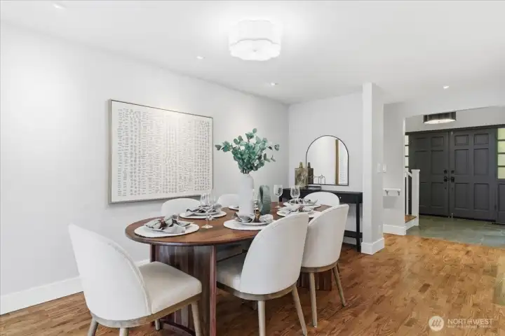 Dining room adjoins the kitchen and sliders open to the back deck and yard