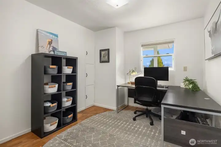 The third bedroom with two smaller built in closet spaces. Currently being used as an office and guest room.