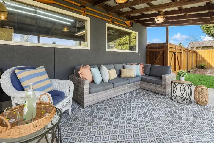 Entertain year-round beneath this covered deck with extrerior lighting.