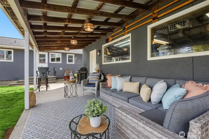 The covered deck faces out onto the expansive back yard.