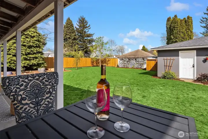 View from the covered deck across the lawn and to the detached garage.