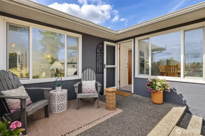 A front porch offers an additional outdoor relaxation area.