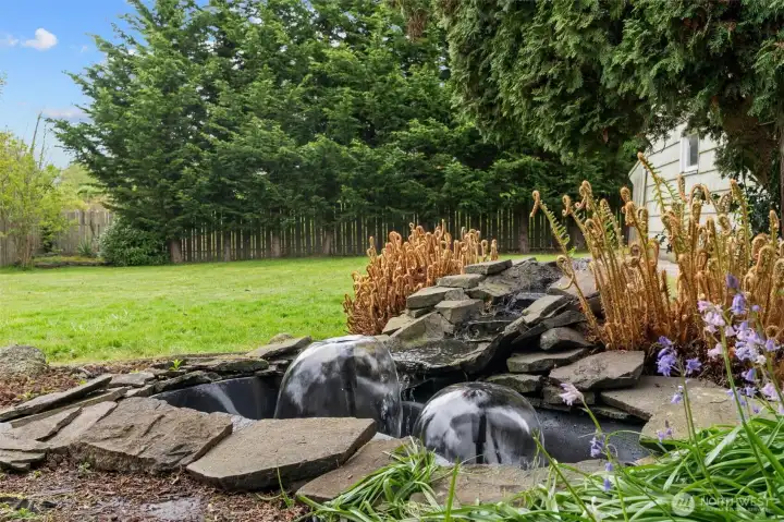 Peaceful water feature in spacious backyard