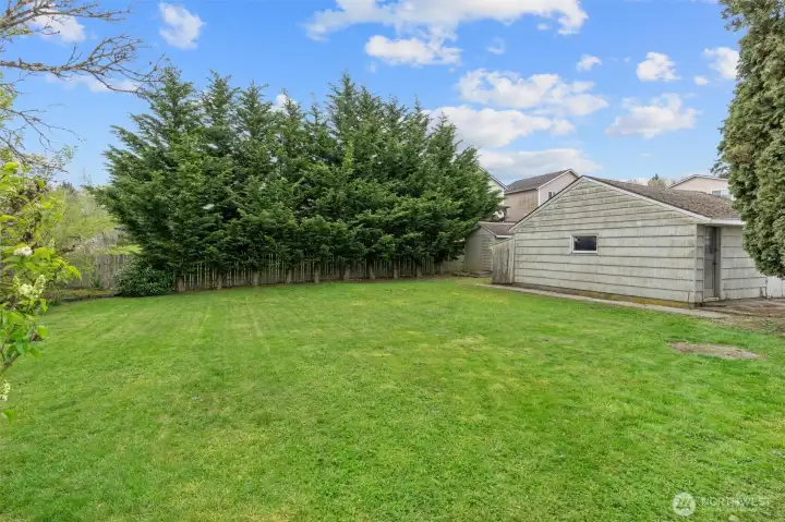 Single-Car Garage with Dedicated Workshop Space, and Separate Storage Shed