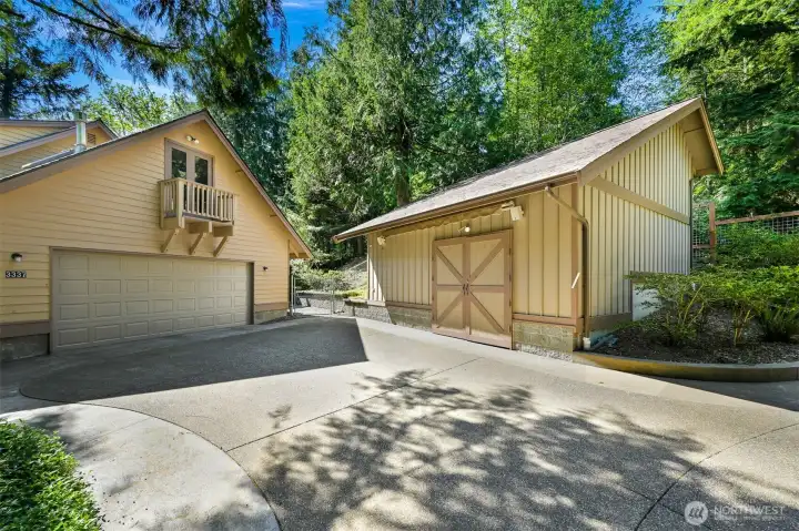 Attached 2 car garage and shop which has a half bath, sink & countertops. Lots of parking!