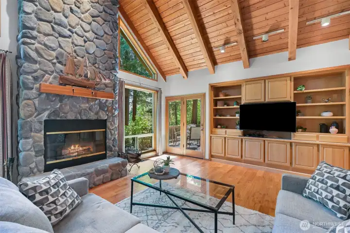 Great room with door to front deck. Sit in your living room and gaze out at the meadow and view the wildlife.