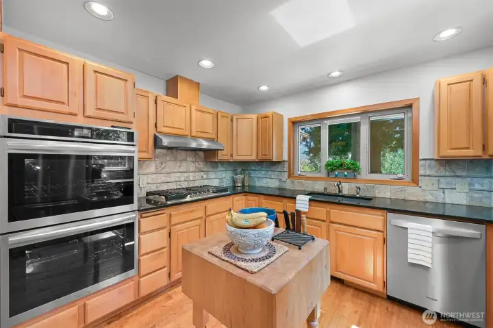 Brand new appliances-check out that double convection oven and oversized gas cooktop, new dishwasher rounds out the package.