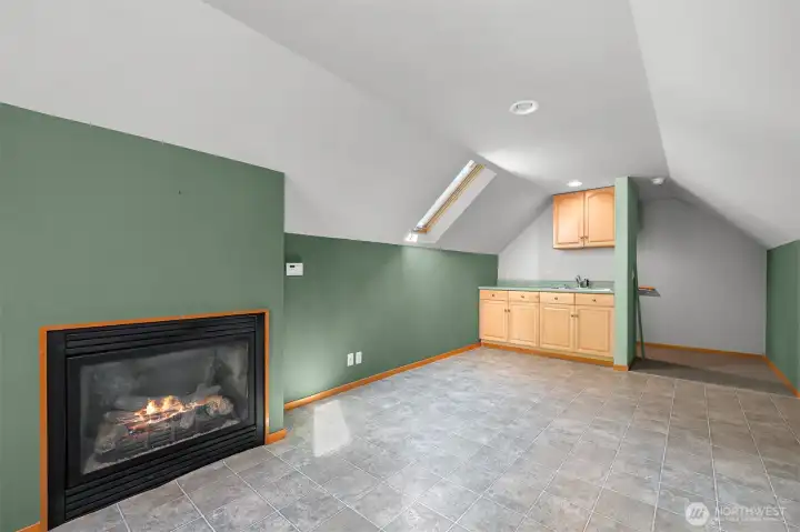 Bonus room with skylights & a little deck above the garage is a great 2nd living space. Possibilities are endless-TV room, game room, craft room, and more. Convenient sink and cozy fireplace.