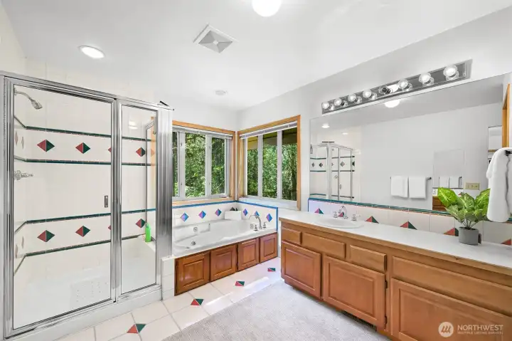Primary bathroom with lots of space and corner windows to frame the beautiful scenery