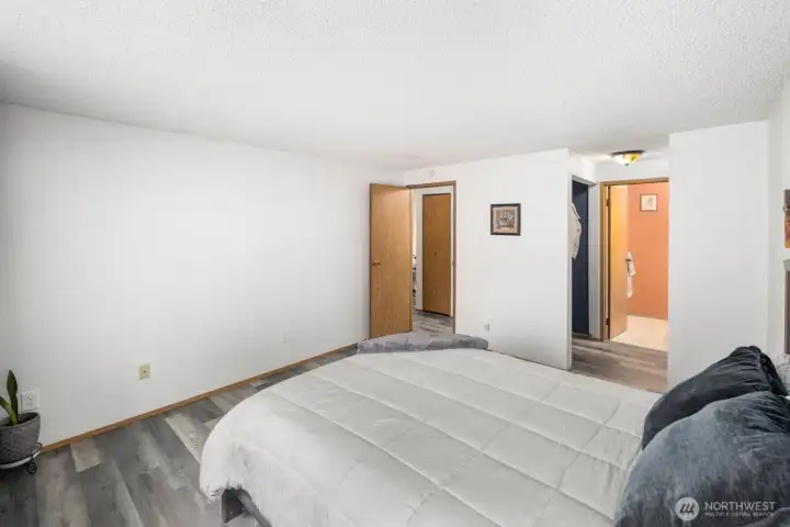 Primary suite with view of ensuite and walk in closet