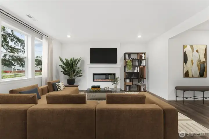 Spacious family room with electric fireplace, wired for TV above the mantel, and tremendous sunlight!  Picture for representational purposes only, colors and features may vary.