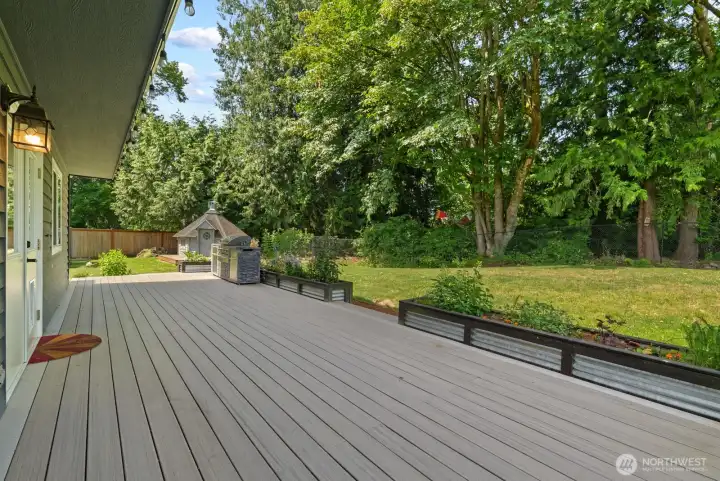 Enormous deck bordered by garden box