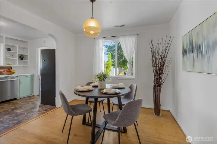 Adorable dining room with original built-in shelves has been opened up to the cute, retro kitchen. Adorable dining room with original built-in shelves has been opened up to the cute, retro kitchen.