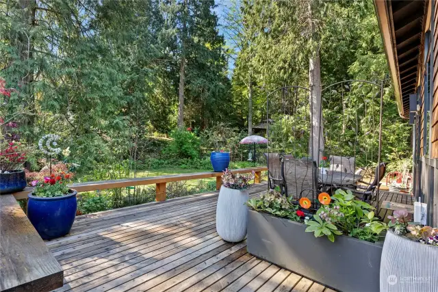 The Expansive deck allows lots of flexibility! Inherit the already established flowering evergreens, award winning peonies, and a variety of dahlias that bloom all summer.