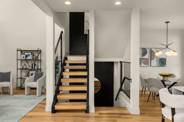 This home boasts all the fine details - including wood cantilevered stairs to bring you to each level.