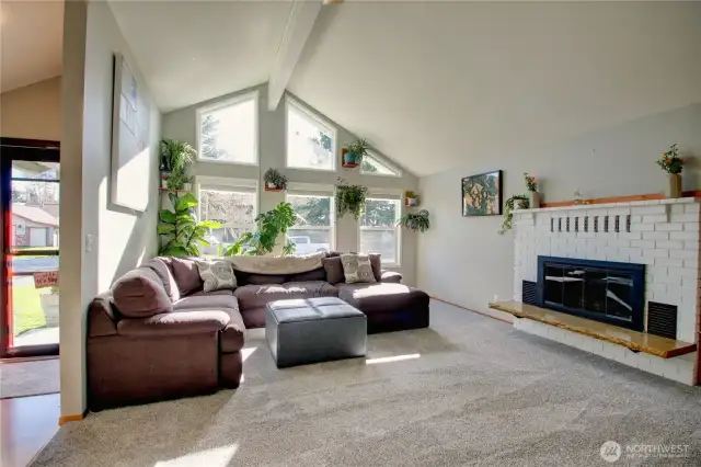 Vaulted ceiling in living room with gas fireplace