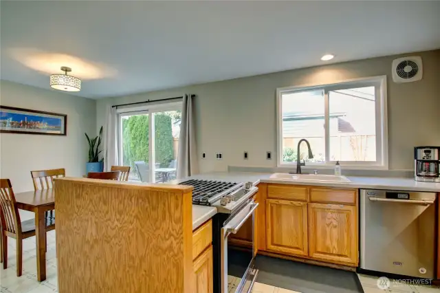 Kitchen and Dining area.  Sliding glass door to the backyard patio.