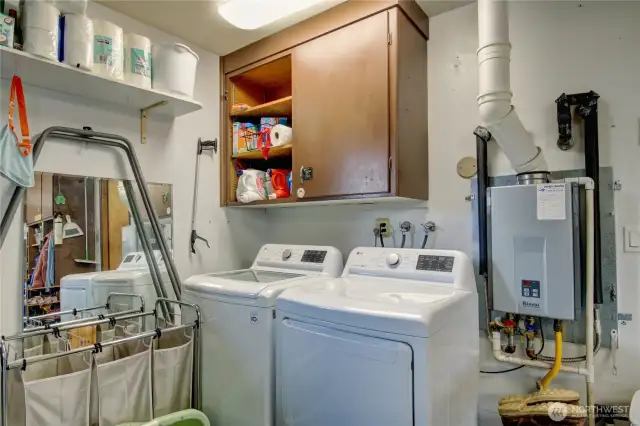 Laundry in the garage.  Tankless water heater (202)