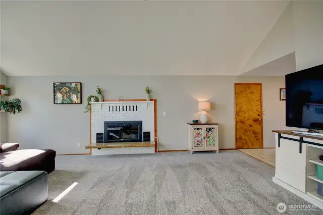 Gas fireplace and man door to garage