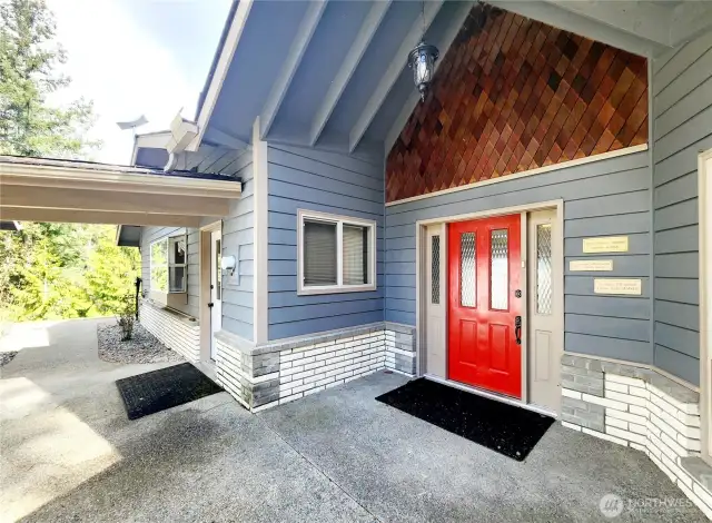 Main Entry with covered breezeway from garage.