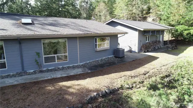 Aerial view of house and detached garage.