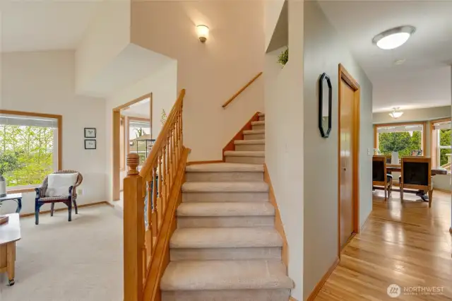 Tall ceiling foyer with steps upstairs...
