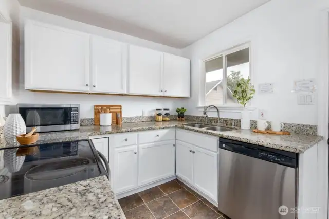 Newly refinished oak cabinets & granite countertops