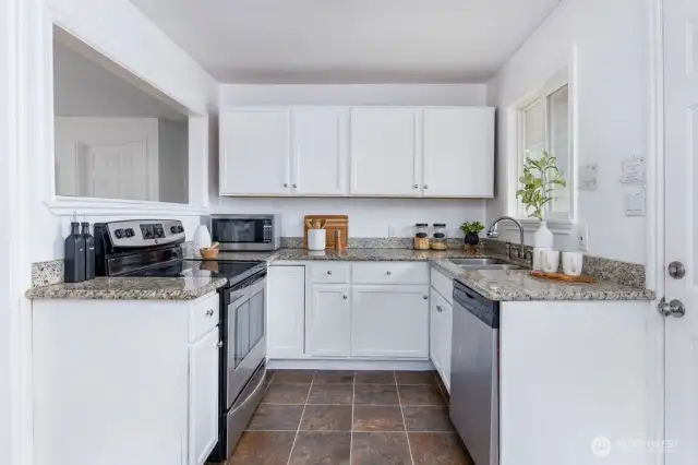 Newly refinished oak cabinets & granite countertops
