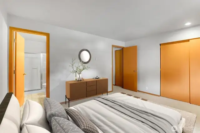 Primary suite with ensuite bathroom and nice closet space. Virtually staged.