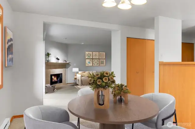 Virtually staged Dining area to living room. Note the closets to the right along the hallway. Amazing panty and storage areas to stay organized.