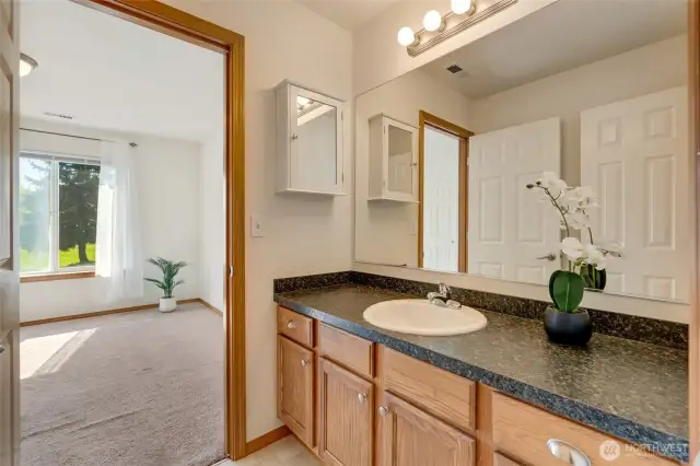 Primary Vanity with private connection to upstairs bath
