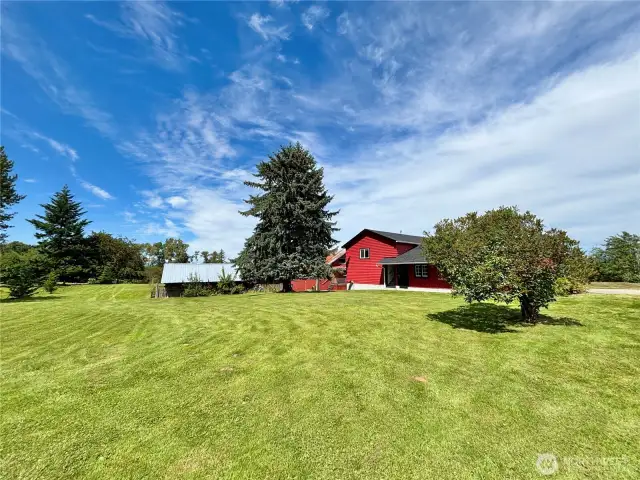 Red building is the apartment on top, show below, plus additional outbuilding to the left.