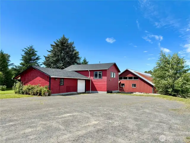 Garage space, upper floor apartment, and barn. RV hookups are to the right of the apartment.