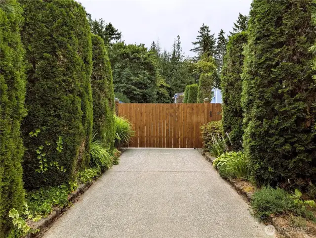 Say Yes to this address. Welcome to #7120 242nd St E, Graham, WA 98338. Gated entry. 3 bedrooms, 2.5 bathrooms & 7 covered parking spaces. .295 acre private location. No HOA!. Private setting backs up to greenbelt