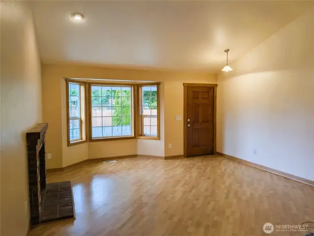 Say Yes to this address. Living room with gasfireplace & bay window. Welcome to #7120 242nd St E, Graham, WA 98338.