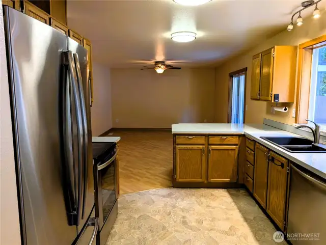 Say Yes to this address. Kitchen with stainless steel appliances. Welcome to #7120 242nd St E, Graham, WA 98338.