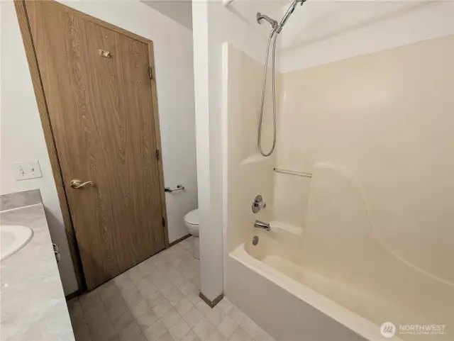 Primary bathroom with dual sinks. Say Yes to this address.  #7120 242nd St E, Graham, WA 98338. New carpet to be intalled prior to closing.