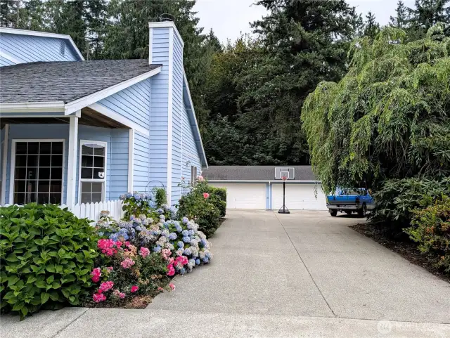 Lots of parking. 5 car detached covered parking plus 2 car attached garage. Say Yes to this address. #7120 242nd St E, Graham, WA 98338.