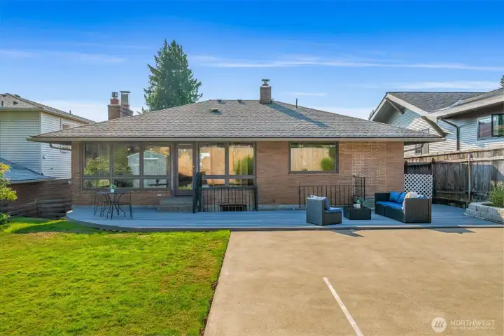 Half size sport court plus an entertaining deck and yard space
