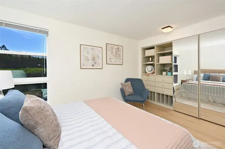 Built in closet storage adds function and organization to the large second bedroom.