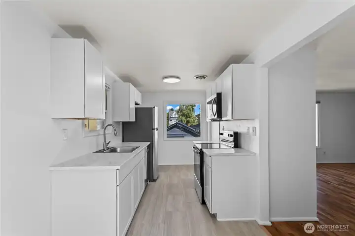 Unit E Kitchen - updated with new flooring, cabinet and appliances