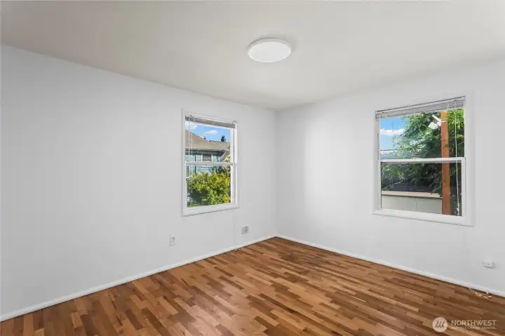 Unit E Bedroom - with original newly sanded hardwood floors
