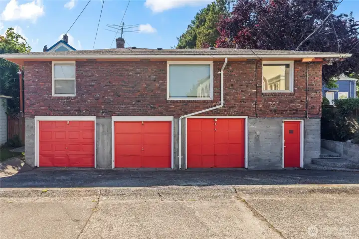 Individual garage spaces provide parking or additional storage options
