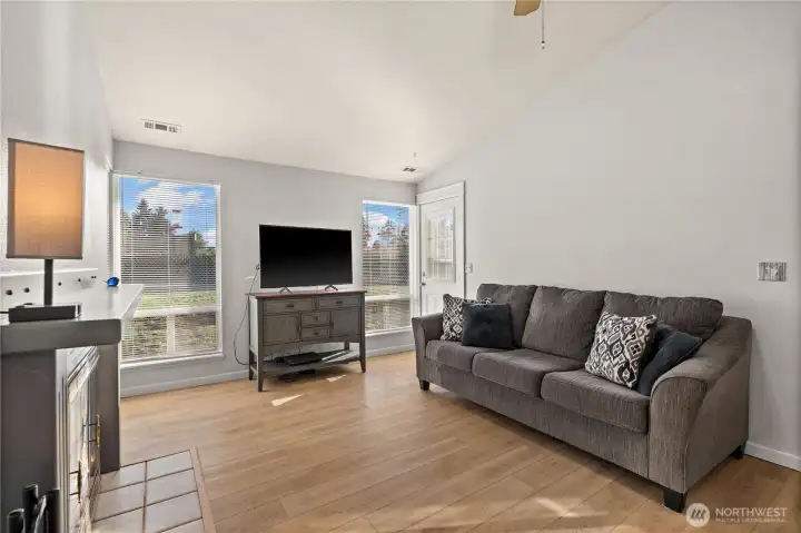 Living room with natural lighting and door to backyard