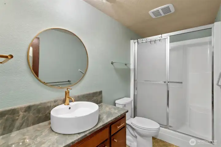 Guest bath has been updated with new counter top and sink.