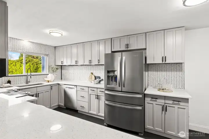 Fully updated kitchen at 4612 N 21st St, Tacoma, WA — featuring quartz countertops, modern shaker cabinets, stainless steel appliances, herringbone tile backsplash, and a bright window overlooking the backyard. This contemporary North Tacoma home offers a spacious, stylish, and functional kitchen ideal for cooking, entertaining, and everyday living.
